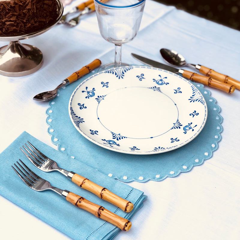bamboo cutlery, scalloped placemats, linen napkins